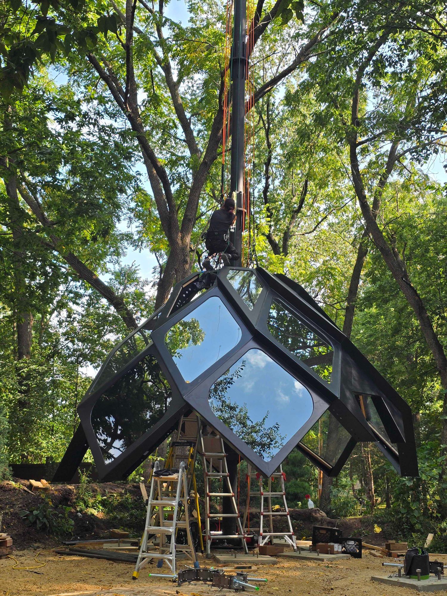 Lunar Lander shell being lifted during installation